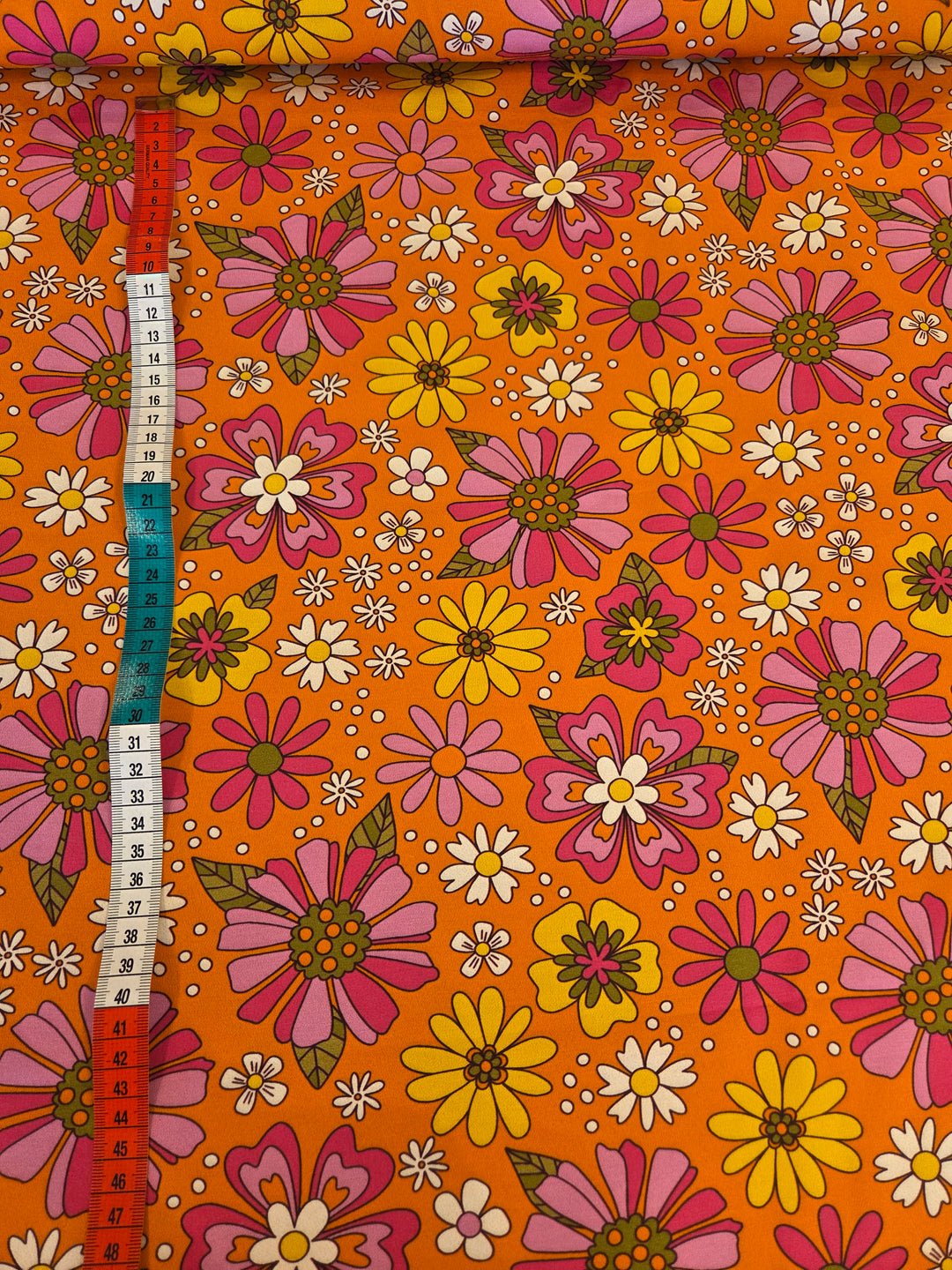 Metervare, Jersey - Blomster oransje